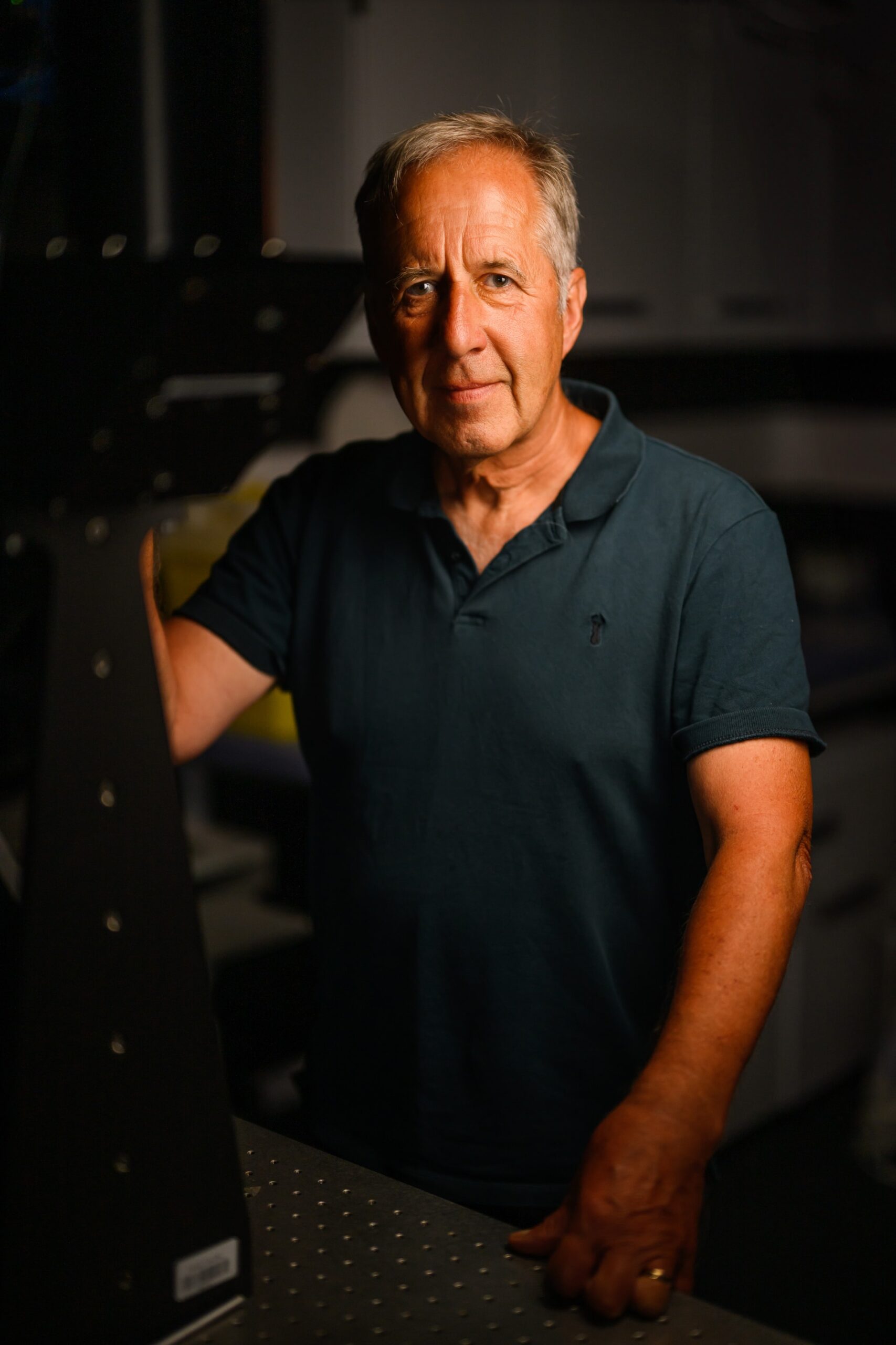 Professor Colin Brownlee standing by Mesolens Microscope