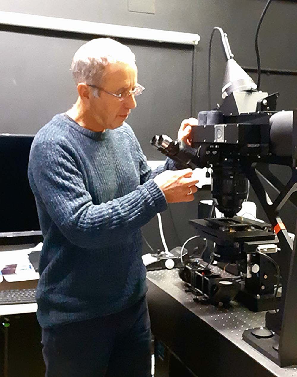 Colin Brownlee adjusting lenses on a Mesolens Microscope