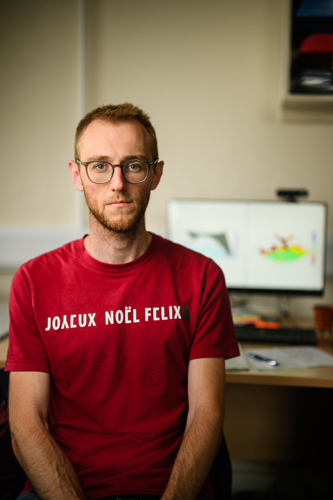 Loick Kleparski in front of his office desk