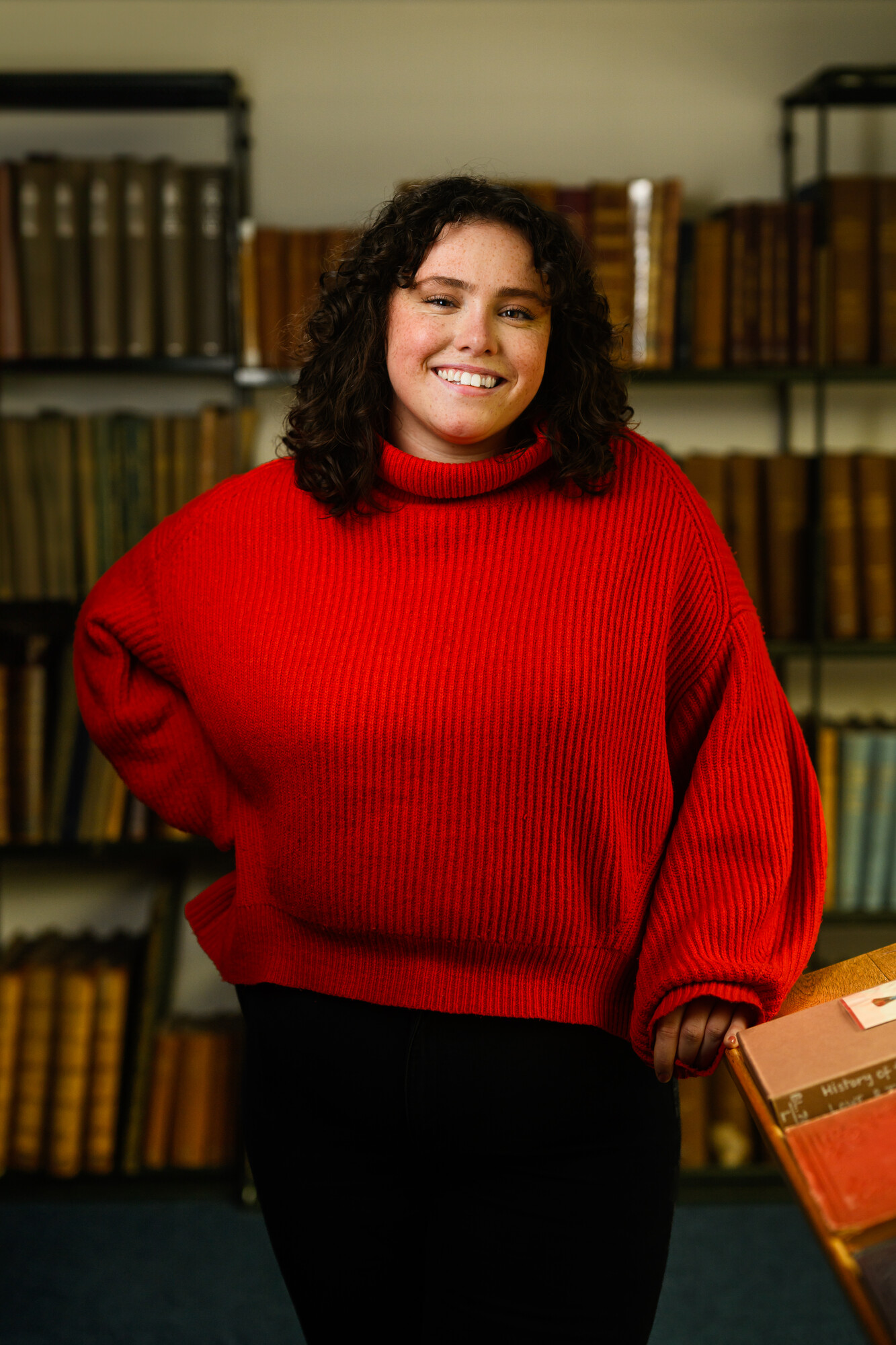 Jenny Thompson standing in library