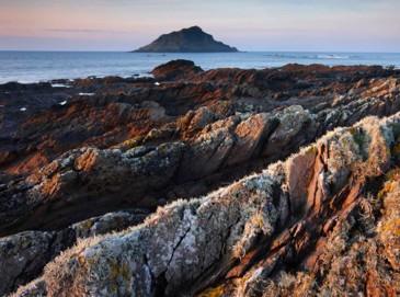 Church Reef, Wembury - a rocky foreshore with the sea and the Mews Stone in the background.