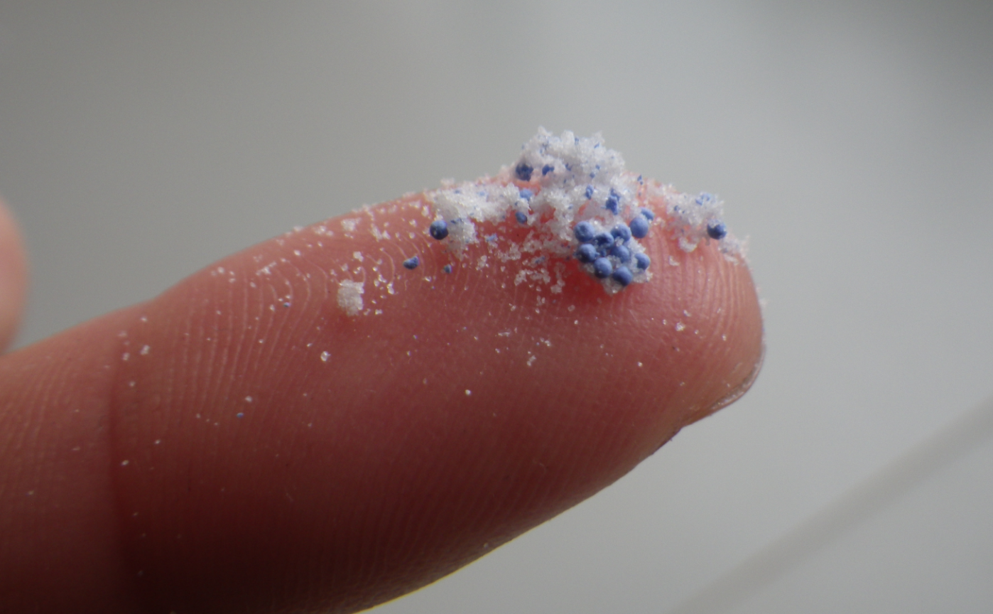 microplastics on finger microplastics on finger at beach