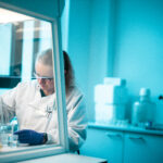 researcher using a pipette in the microbiome lab